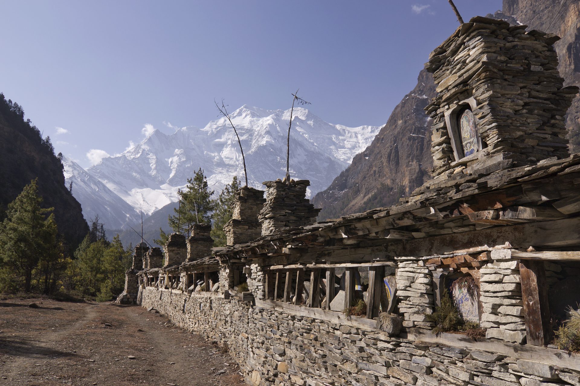 Carved mani stones beside the path. — Manaslu Circuit Trek: Complete 2026 Guide