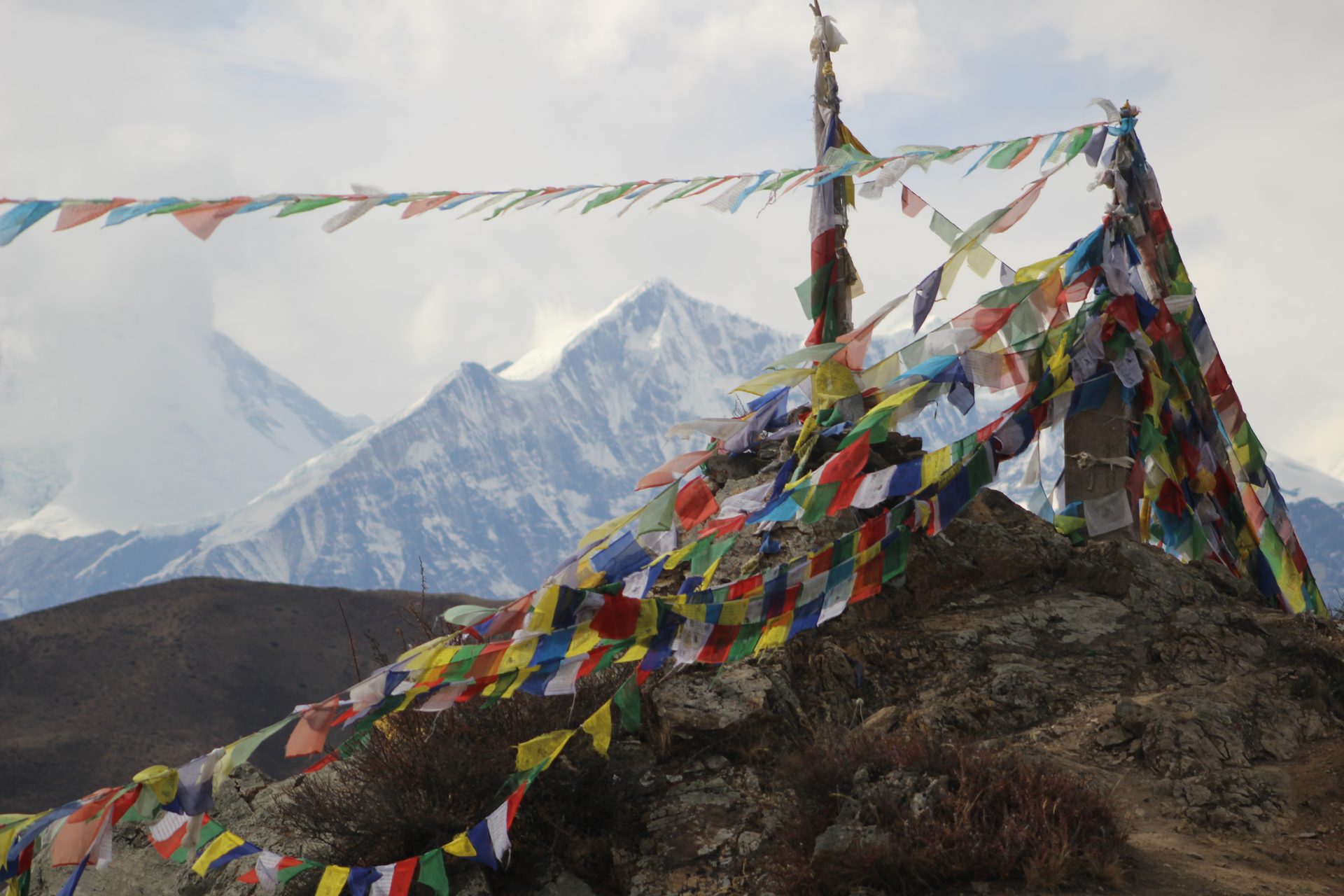 Prayer flags carry blessings on the wind. — Upper Mustang Jeep Tour: Lo Manthang Without the Trek